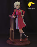 Sculptor's render of the painted design (kit ships unpainted): full-figure three-quarter view of the smiling blonde girl in a red coat dress and cropped jacket, one hand on a wooden fence rail, standing on a round plank floor
