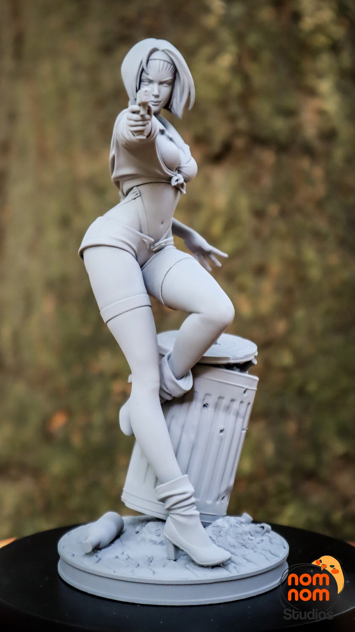 Sculptor's photo of an unpainted print: front view with the pistol aimed toward the camera