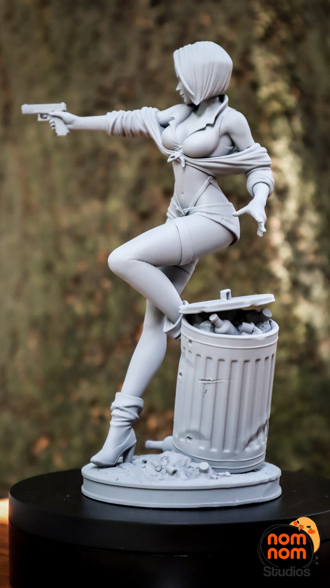 Sculptor's photo of an unpainted print: view from the pistol side with the open trash can full of garbage
