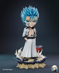 Sculptor's render of the painted design (kit ships unpainted): front view of the blue-haired brawler standing in a sand and rock crater, hands in his pockets, with white smoke and a broken red pillar behind him