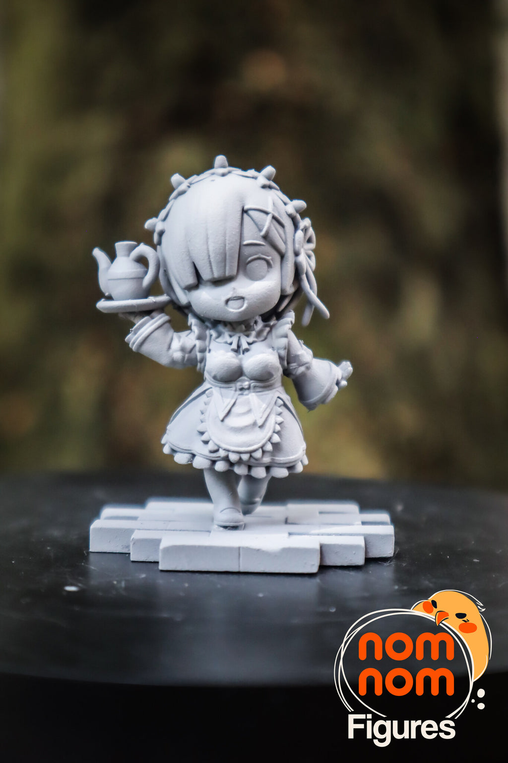 Sculptor's photo of an unpainted print: the tray-carrying twin on her own tile, from the front