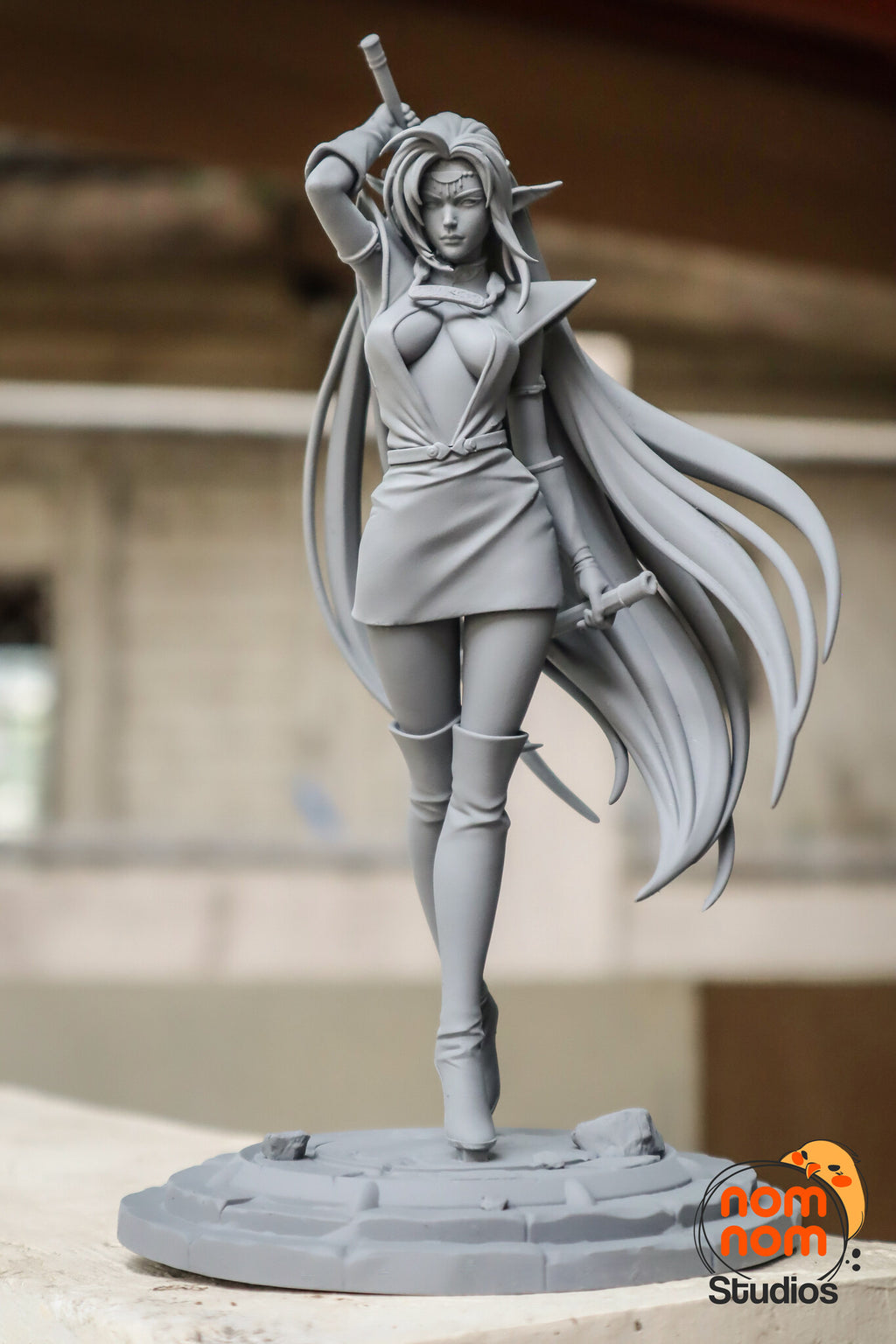 Sculptor's photo of an unpainted print of the full-size figure (kit ships unpainted): front view of the gray resin figure standing on the stone plinth. The miniature is the same sculpt at 85 mm tall.