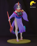 Sculptor's render of the painted design (kit ships unpainted): front view of the horned dragon girl in a lavender robe and orange scarf, holding a coral-red clawed staff and a pastry, with a finned violet tail, on a round paved base