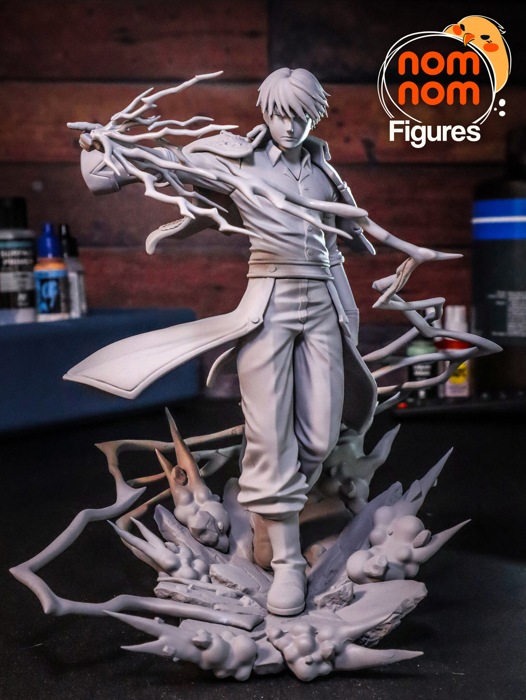 Sculptor's photo of an unpainted print: front view of the full figure with the lightning and smoke on the rock base