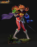 Sculptor's render of the painted design (kit ships unpainted): full front view of the orange-haired spellcaster holding a green fireball, sword lowered and purple cape flying, on the leafy base