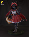 Sculptor's render of the painted design (kit ships unpainted): front view of the wolf monster girl in a red hooded cape and red dress, waving one clawed paw and holding a picnic basket, on a round grassy base