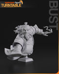 Sculptor's render of the design, shown in gray (kit ships unpainted): bust of the bearded old general, one robe sleeve flared and one hand reaching out, on a stepped plinth