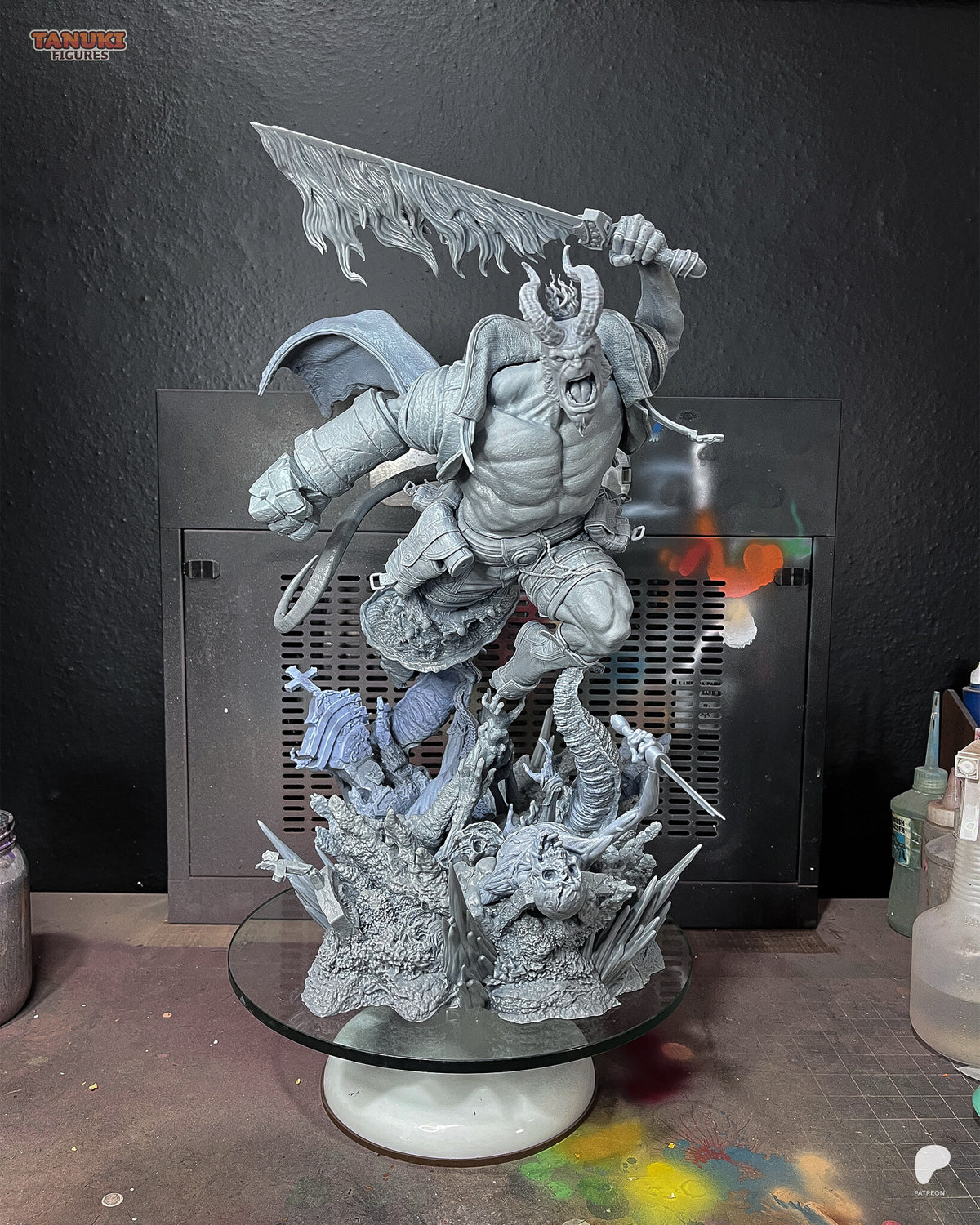 Studio photo of the sculptor's unpainted test print (kit ships unpainted): the full statue from the front, built with the long-horned crowned head