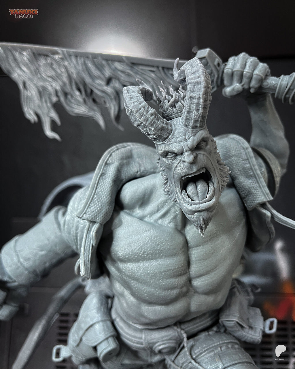 Studio photo of the unpainted test print (kit ships unpainted): close-up of the long-horned head with the small crown of flames