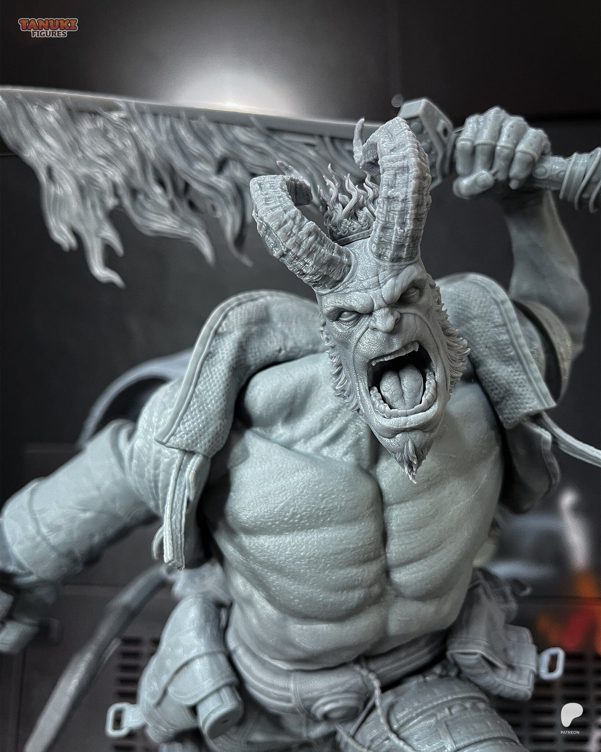 Studio photo of the unpainted test print (kit ships unpainted): close-up of the long-horned head with the small crown of flames