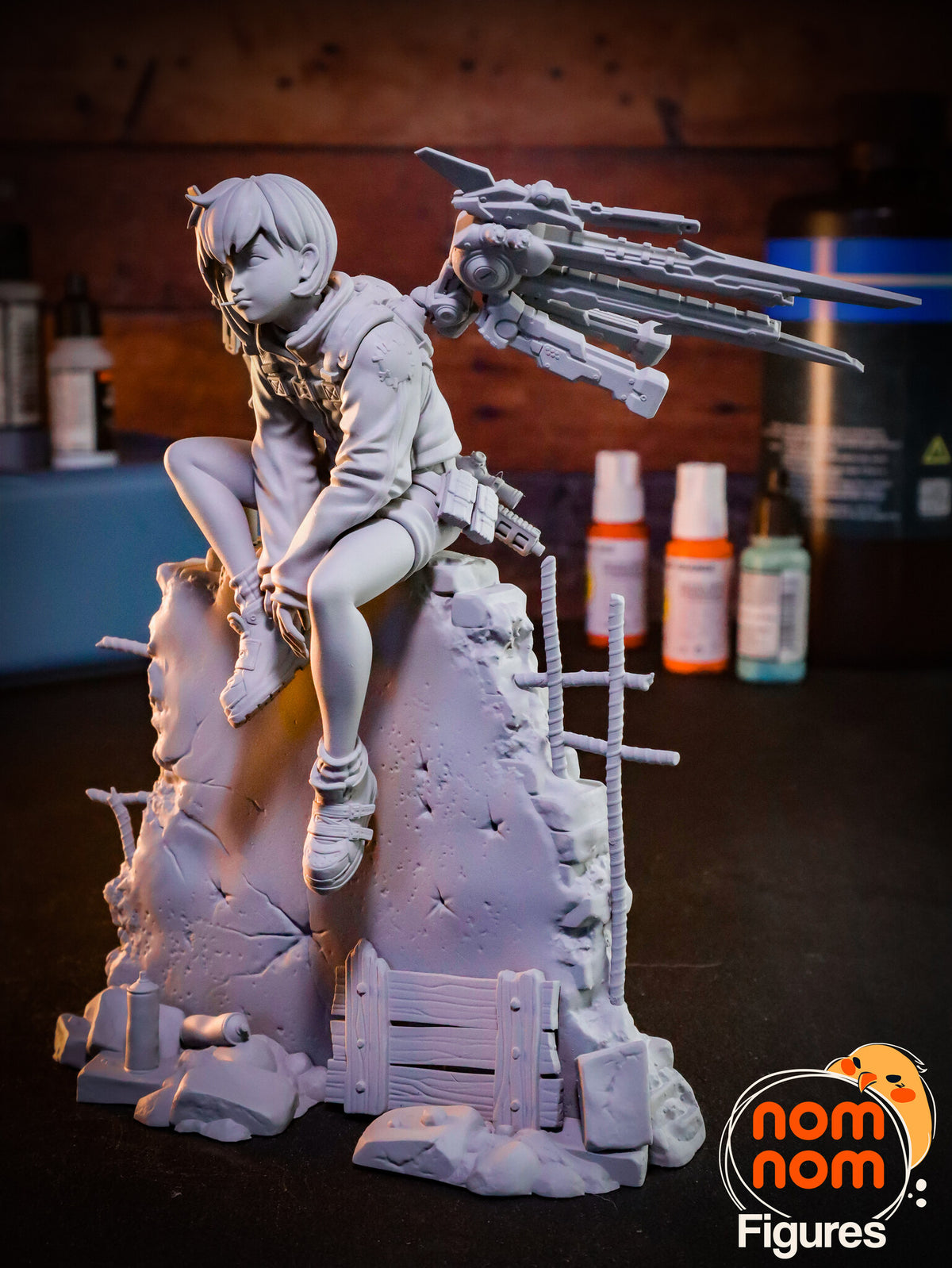 Sculptor's photo of an unpainted print: view from her left side with one wing swept back and the rebar cross beside the wall