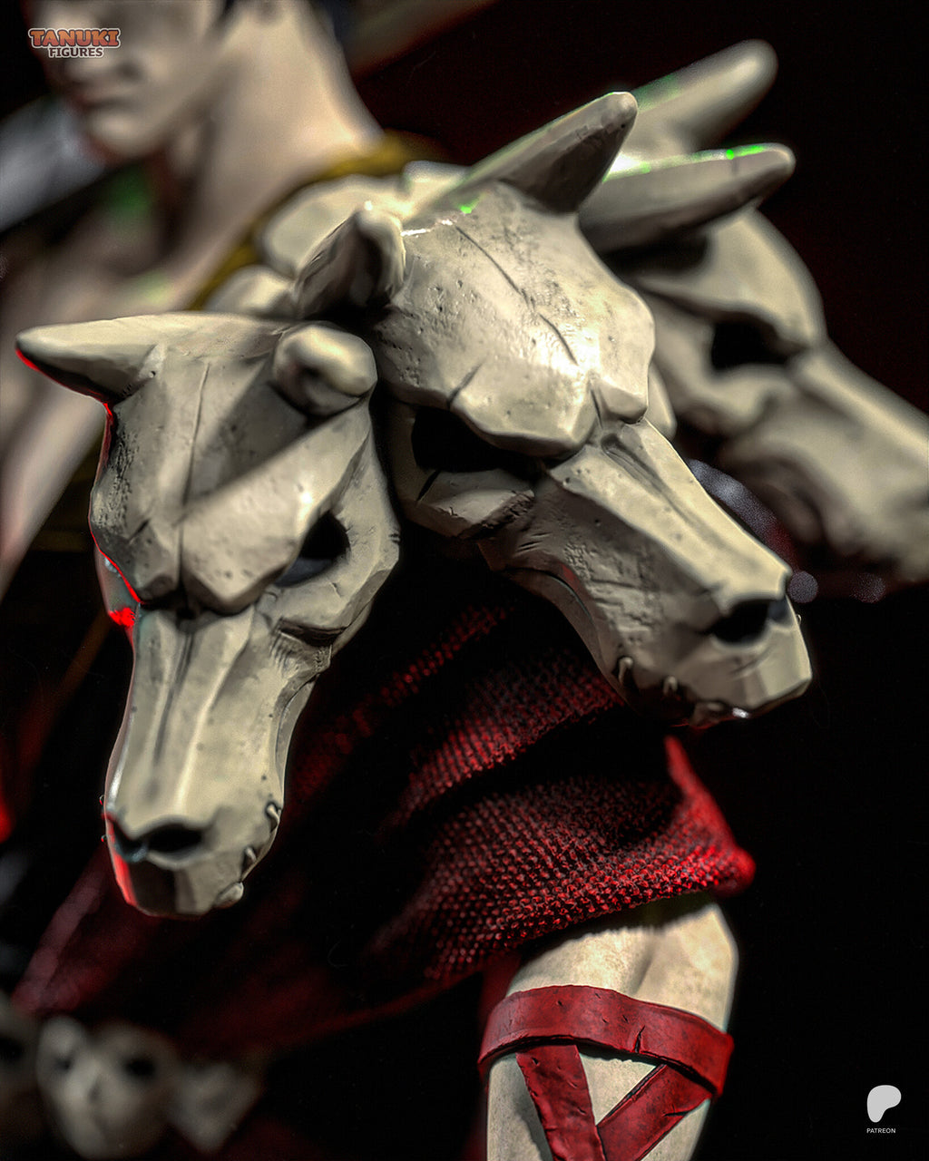 Sculptor's render (kit ships unpainted): close-up of the pauldron of three cracked hound skulls over the crimson woven drape