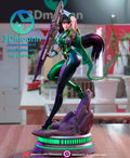 Sculptor's render of the painted design (kit ships unpainted): front three-quarter view of the full figure on one leg with the giant sword raised, on the oval base with its glowing green ring